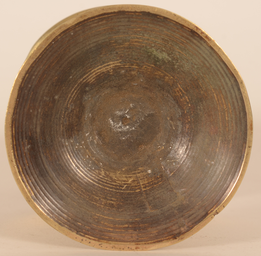 A brass Flemish renaissance candlestick — Detail of the bottom of the base