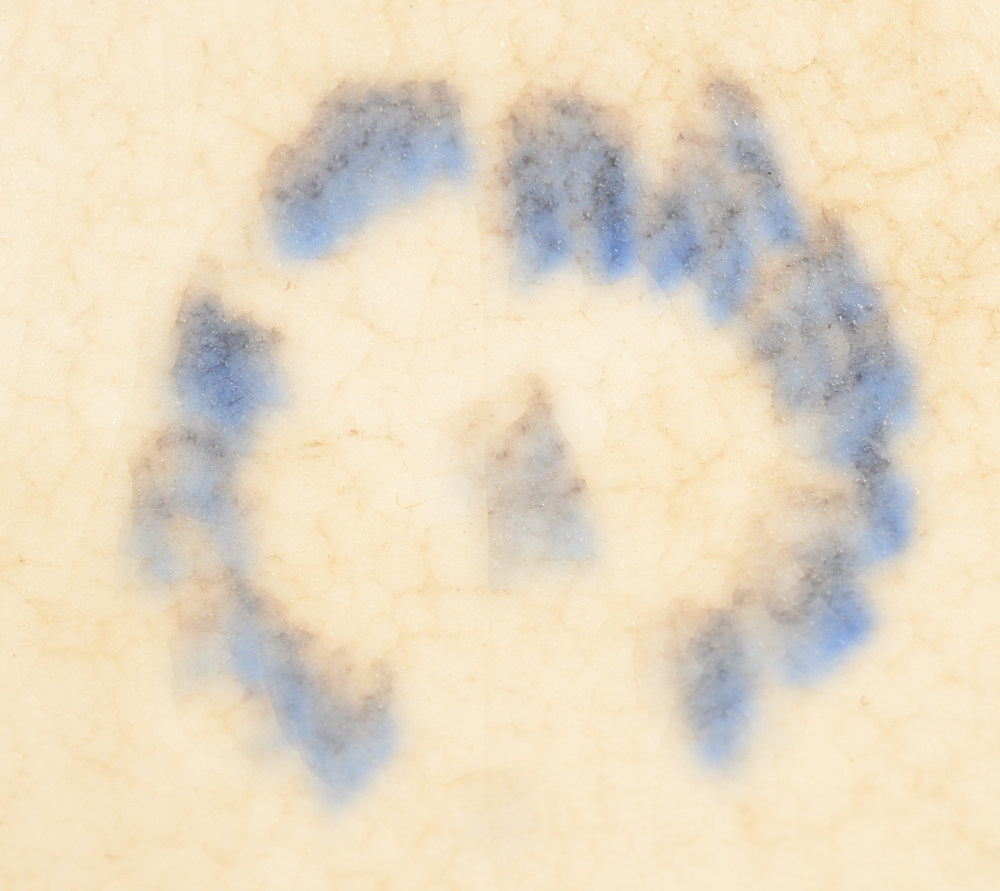 Ceramique de Bruxelles — blurred but typical circular mark of the manufacture at the bottom of the base