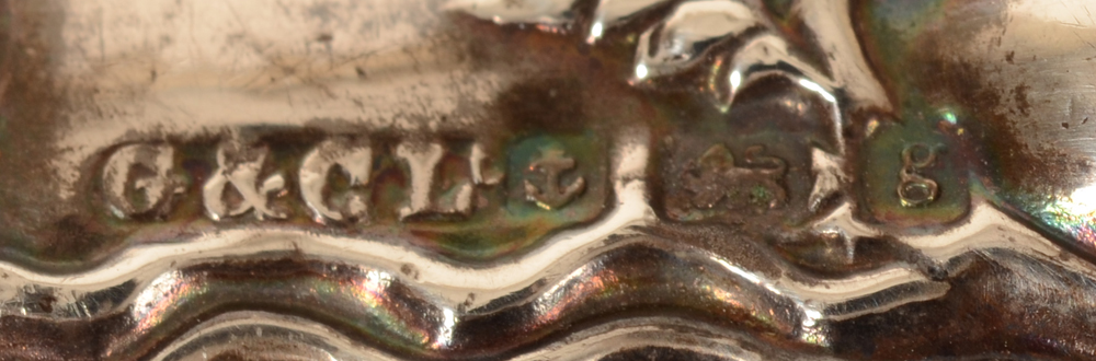 Sterling silver clothes brush — Marks on the handle of the piece