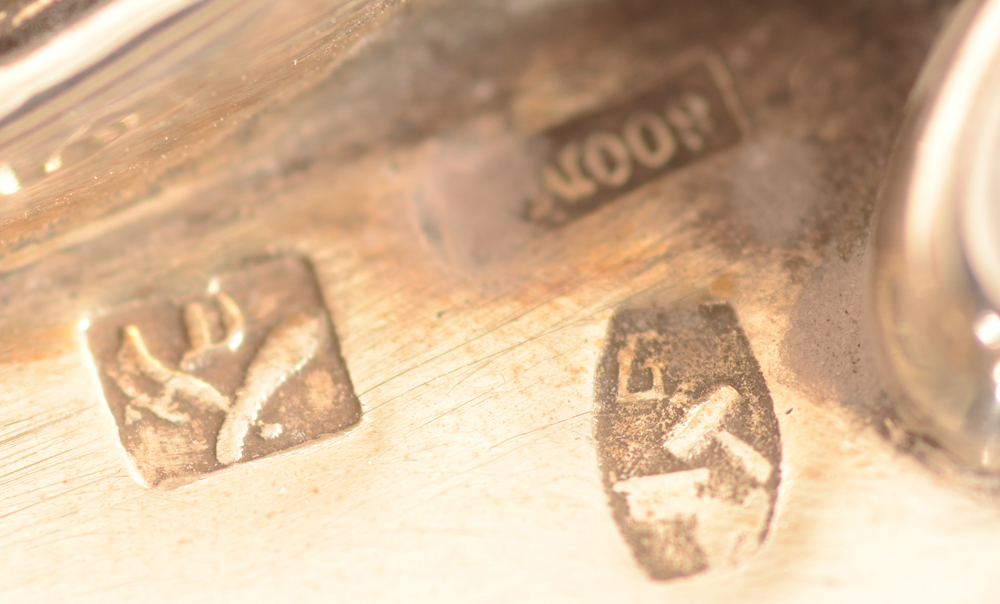 Debaus — Detail of the marks: makers mark of the Debaus firm, alloy mark for 800/1000 and later Belgian retailer mark.