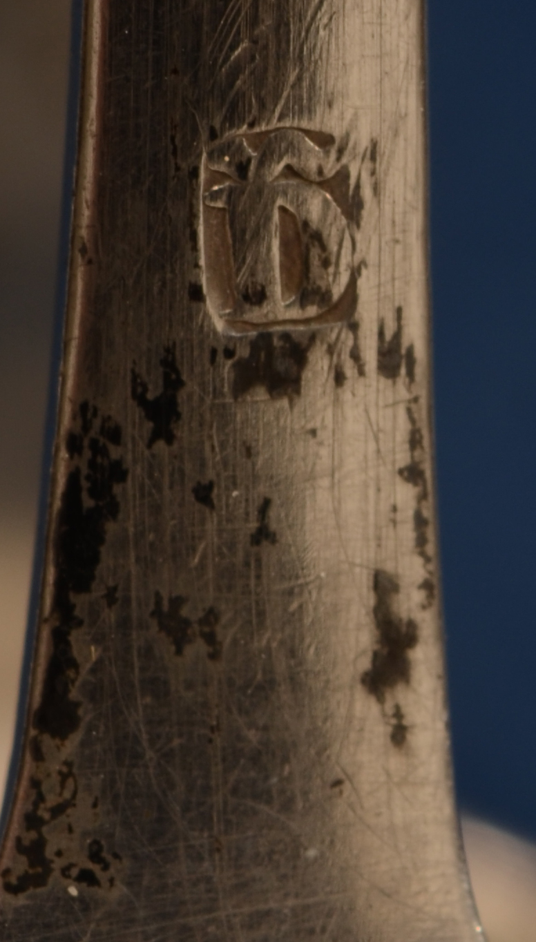 Delheid Frères — Makers mark on one of the tongs.