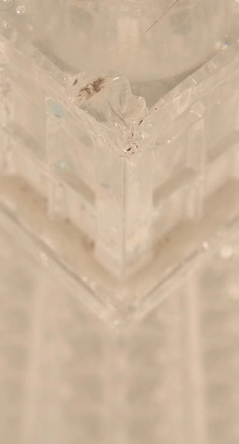 Eiffel tower candlesticks — Detail of the chip tot the top of one of the candlesticks
