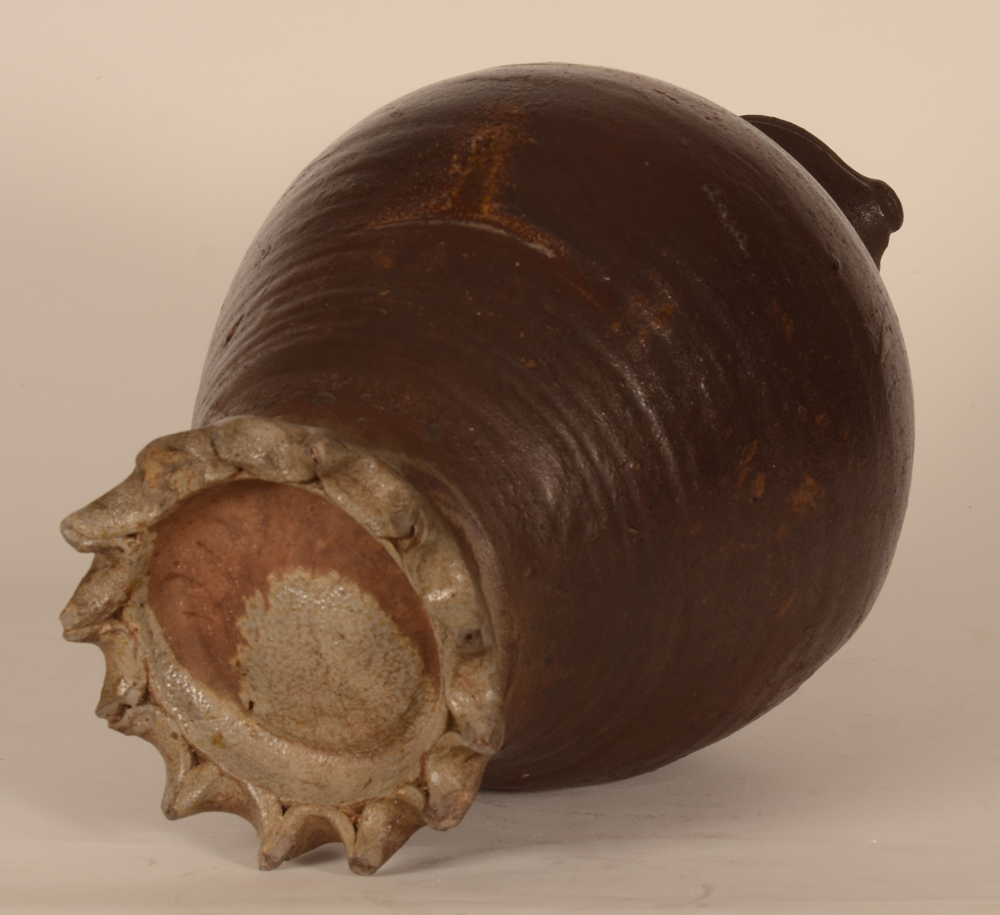 Langerwehe Pitcher — With a typical crown foot with large dents beneath the curved and turned body