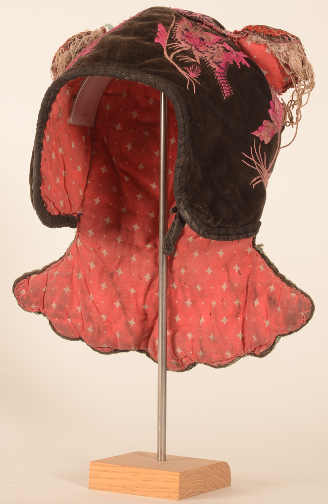 Miao brown velvet embroidered baby's cap — 3/4 frontal view, comes with the stand