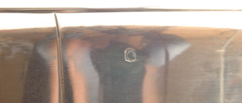 Jean E. Puiforcat — The Mercure mark, exportation mark for 950/1000 alloy, near the edge of the rim.