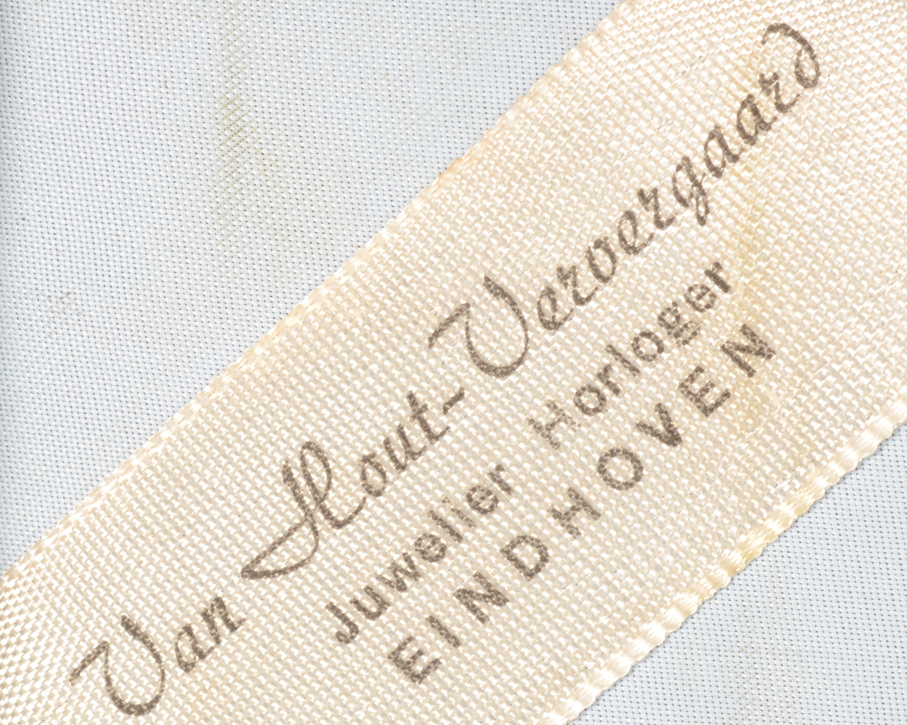 NV Zilverfabriek Voorschoten — Original vendors label of the shrine, the firm of Van Hout - Ververgaard in Eindhoven