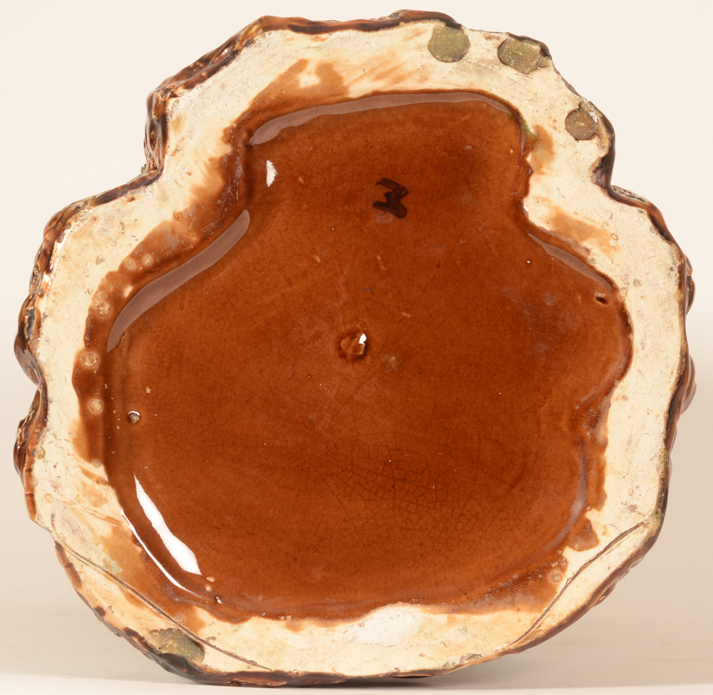 Victorian majolica umbrella stand — Teh base of the piecen with an underglaze M mark