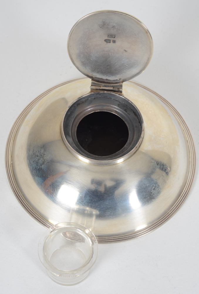 Arts and Crafts sterling silver inkwell — the inkwell open, a minor chip to the glass container