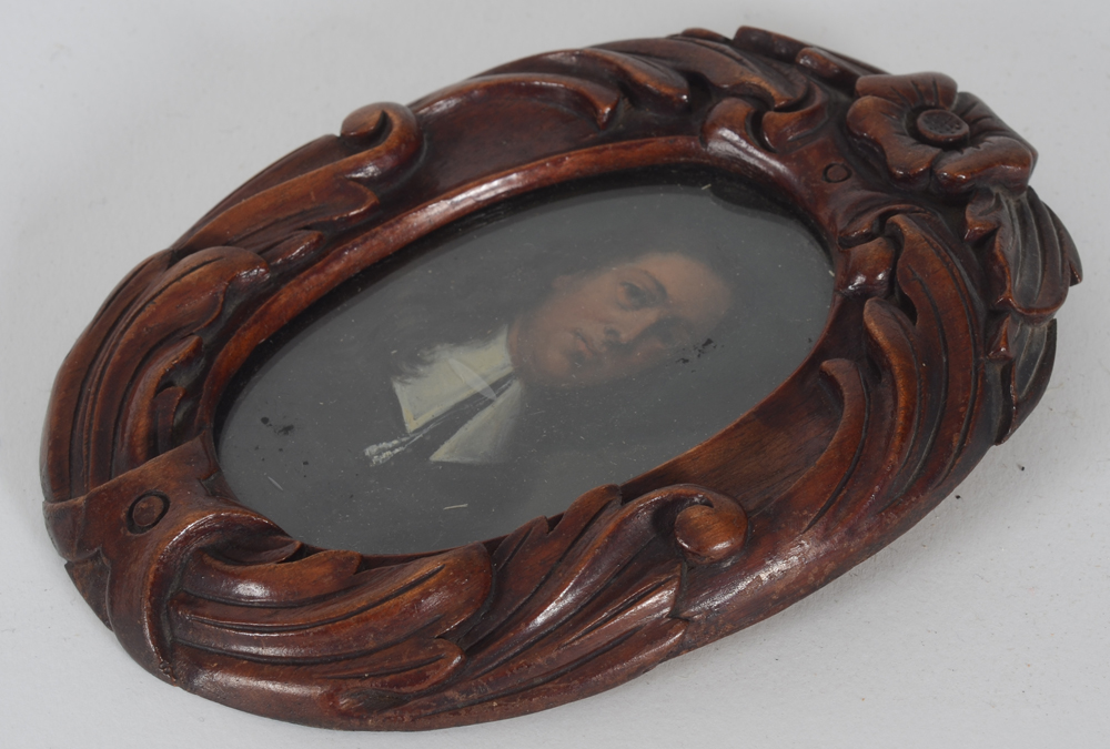 Old Miniature of a man  — A view of the carved wooden frame