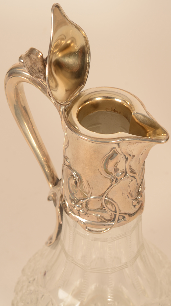 Wilkens a pair of art nouveau silver and cut crystal carafes — the carafe open