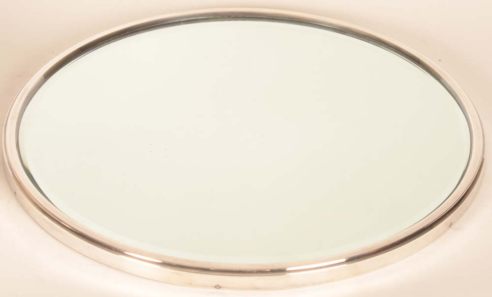 Wolfers Frères — The surtout or mirror, with bevelled glass and silver rim
