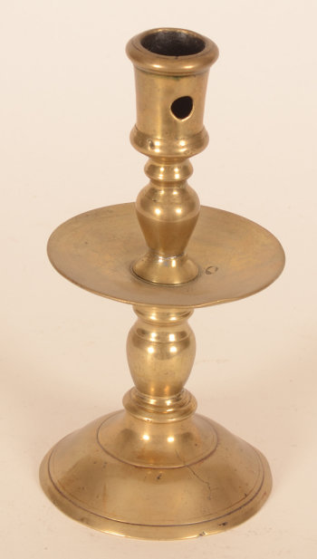 A brass Flemish renaissance candlestick